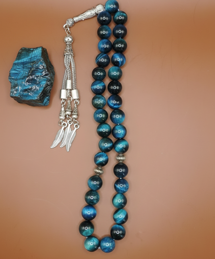 Close-up of teal tiger eye beads showing distinctive striped pattern